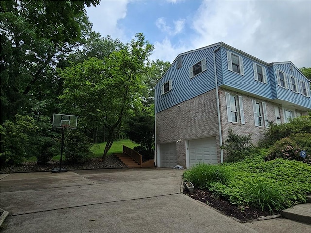 728 Heathergate, Indiana Twp Nal, PA 15238 - view of side of property with brick siding, a garage, and driveway