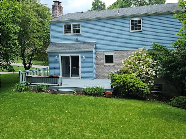 728 Heathergate, Indiana Twp Nal, PA 15238 - back of property featuring a lawn, a wooden deck, a chimney, roof with shingles, and brick siding