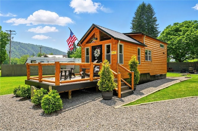 319 Ferry Ln, North-Other Area, PA 16370 - rear view of house featuring log veneer siding, a deck with mountain view, and metal roof