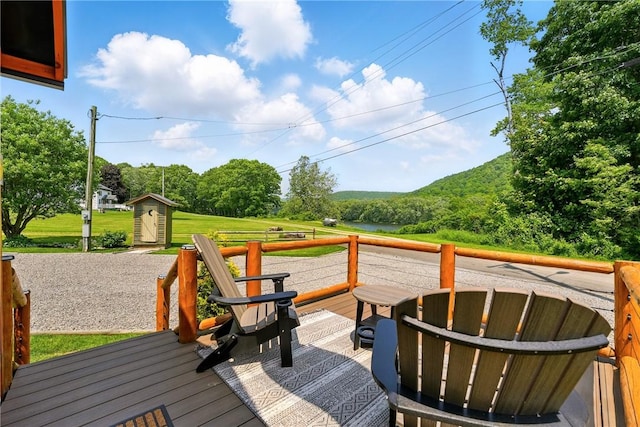 319 Ferry Ln, North-Other Area, PA 16370 - wooden deck featuring a fire pit and a lawn