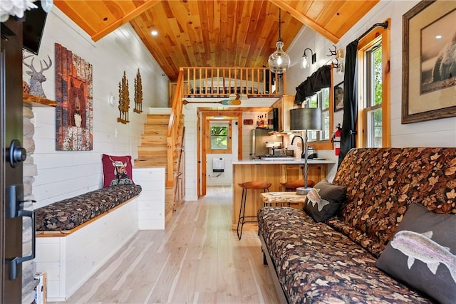319 Ferry Ln, North-Other Area, PA 16370 - living area with wood ceiling, light wood-type flooring, stairs, and wooden walls
