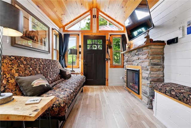 319 Ferry Ln, North-Other Area, PA 16370 - entryway with wood-type flooring, vaulted ceiling, wooden ceiling, healthy amount of natural light, and a fireplace