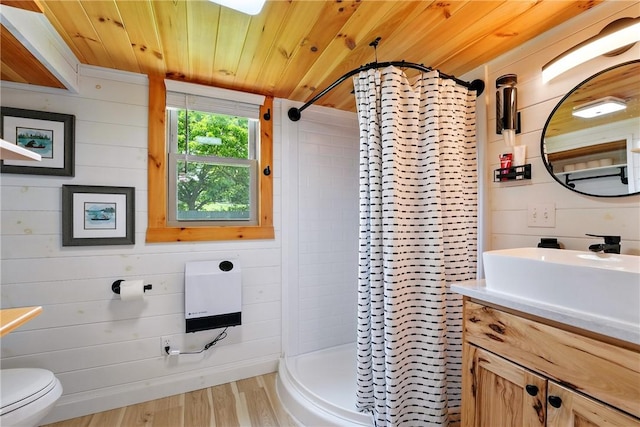 319 Ferry Ln, North-Other Area, PA 16370 - bathroom featuring vanity, a stall shower, wood finished floors, heating unit, and toilet