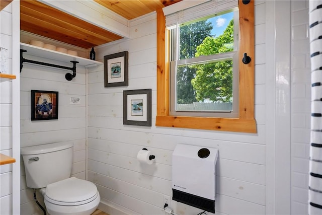 319 Ferry Ln, North-Other Area, PA 16370 - full bathroom with heating unit, wood ceiling, toilet, and wooden walls
