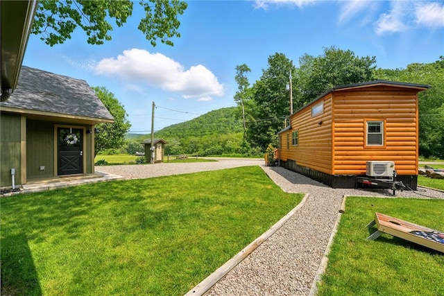 319 Ferry Ln, North-Other Area, PA 16370 - view of grassy yard with a cooling unit and a mountain view