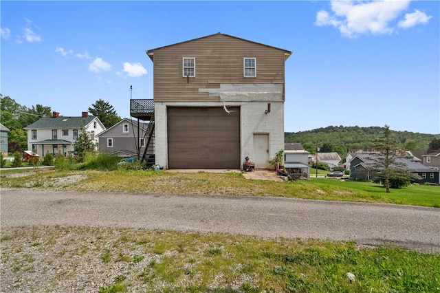 147 Church St, Claysville, PA 15323 - view of front of house featuring an attached garage, a residential view, and driveway