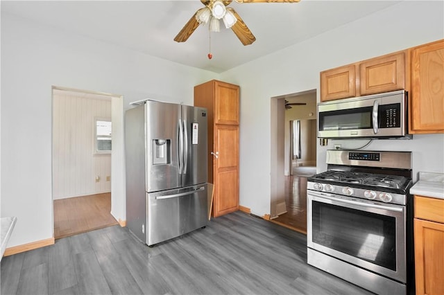 147 Church St, Claysville, PA 15323 - kitchen with stainless steel appliances, a ceiling fan, wood finished floors, baseboards, and light countertops