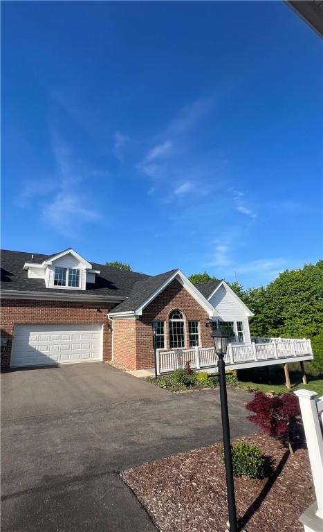 1558 NW Parkwood Pointe Dr, Moon/Crescent Twp, PA 15046 - view of front of home featuring brick siding, driveway, and an attached garage