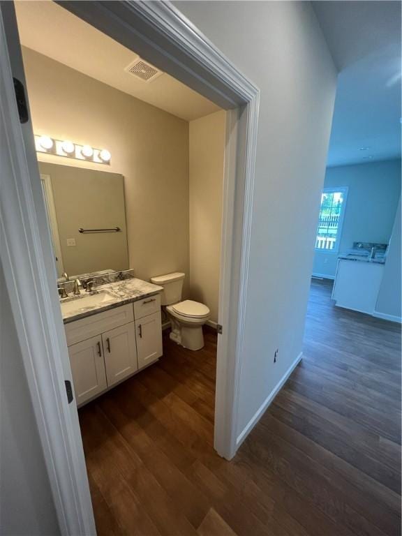 1558 NW Parkwood Pointe Dr, Moon/Crescent Twp, PA 15046 - half bathroom with wood finished floors, vanity, and toilet