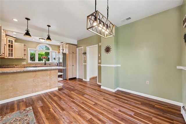 203 E Main St, New Alexandria, PA 15670 - kitchen featuring dark wood finished floors, baseboards, open shelves, glass insert cabinets, and pendant lighting