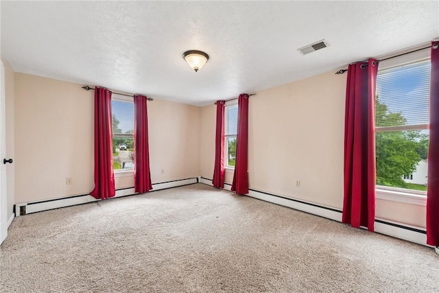 203 E Main St, New Alexandria, PA 15670 - spare room with healthy amount of natural light and a textured ceiling