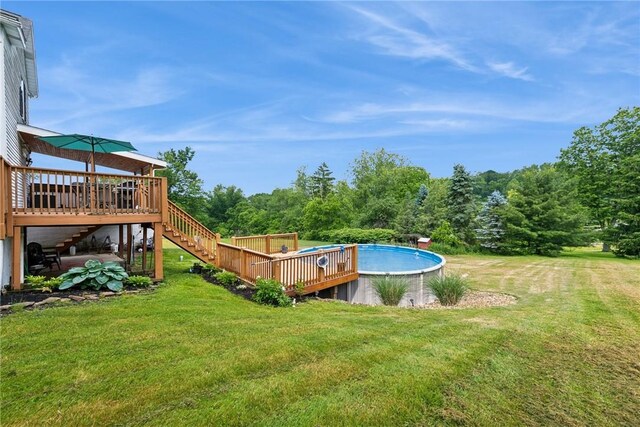 203 E Main St, New Alexandria, PA 15670 - outdoor pool featuring a wooden deck, stairway, and a yard