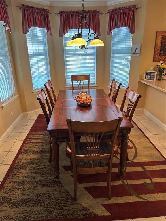 234 Adams Pointe Blvd Unit 10, Adams Twp, PA 16046 - dining space featuring light tile patterned flooring, a chandelier, and baseboards