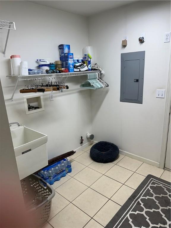 234 Adams Pointe Blvd Unit 10, Adams Twp, PA 16046 - laundry area with electric panel, washer hookup, light tile patterned floors, and baseboards