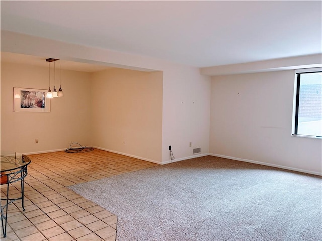 220 N Dithridge Unit 907, Oakland, PA 15213 - empty room featuring light tile patterned flooring, baseboards, and light carpet