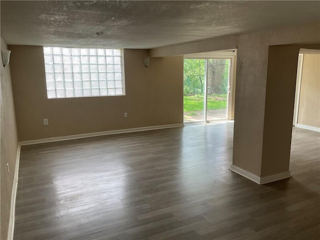 157 Suncrest Dr, Verona, PA 15147 - empty room featuring plenty of natural light, wood finished floors, and baseboards