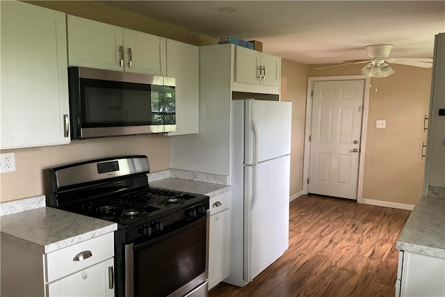 157 Suncrest Dr, Verona, PA 15147 - kitchen with appliances with stainless steel finishes, wood finished floors, ceiling fan, light countertops, and white cabinetry