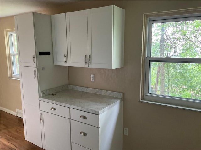 157 Suncrest Dr, Verona, PA 15147 - kitchen with light countertops, white cabinets, wood finished floors, and baseboards