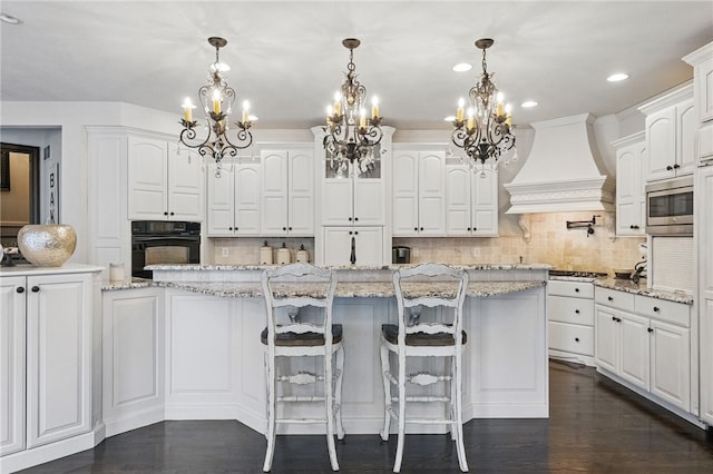 527 Salem Heights Dr, Pine Twp Nal, PA 15044 - kitchen with black oven, premium range hood, a chandelier, and stainless steel microwave