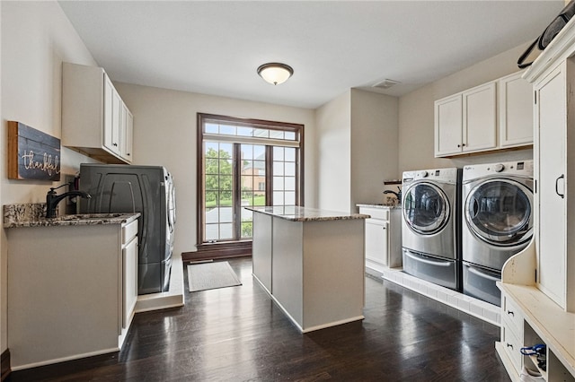 527 Salem Heights Dr, Pine Twp Nal, PA 15044 - laundry area with separate washer and dryer, dark wood finished floors, baseboards, and cabinet space