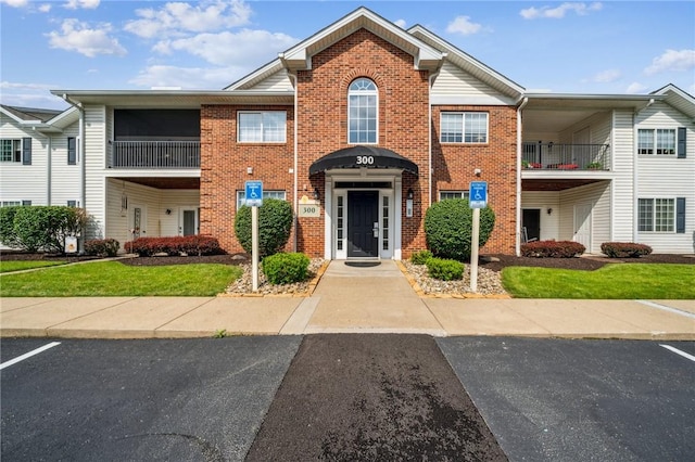 300 Hidden Ridge Ct Unit 203, South Park, PA 15129 - view of property featuring brick siding and a front yard
