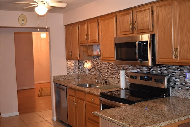 117 Queens Way N, Strabane, PA 15317 - kitchen with stainless steel appliances, ceiling fan, a sink, and decorative backsplash