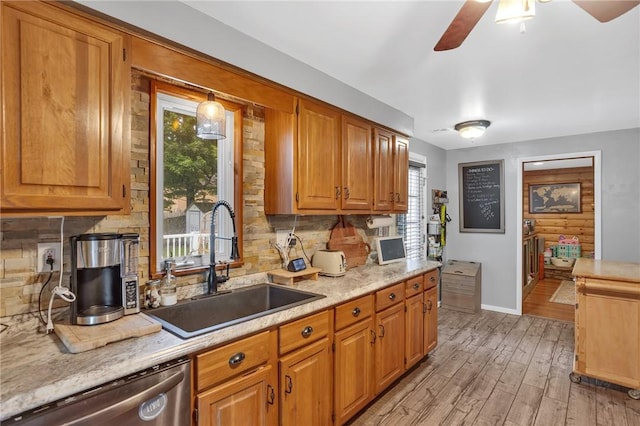 600 Buckingham Dr, Hempfield Twp, PA 15601 - kitchen with dishwasher, a sink, light countertops, backsplash, and light wood-type flooring