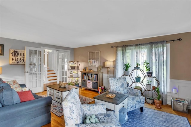 600 Buckingham Dr, Hempfield Twp, PA 15601 - living area with a wainscoted wall, wood finished floors, and stairway