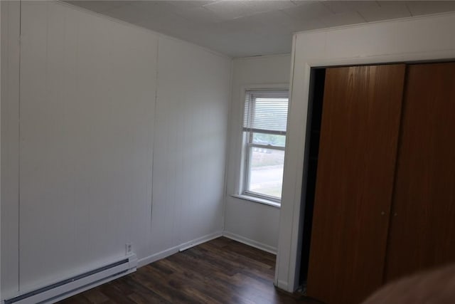 165 W Wylie Ave, City Of Washington, PA 15301 - unfurnished bedroom featuring a baseboard radiator, dark wood finished floors, a closet, and baseboards