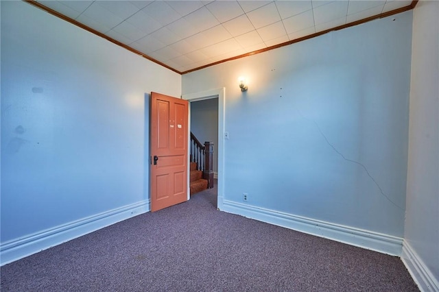 320 Garfield St, W Kittanning Boro, PA 16201 - spare room with crown molding, dark colored carpet, baseboards, and stairway