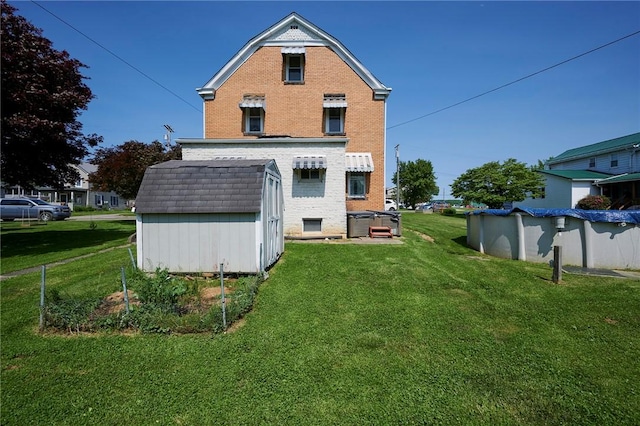 320 Garfield St, W Kittanning Boro, PA 16201 - back of property with brick siding and a lawn