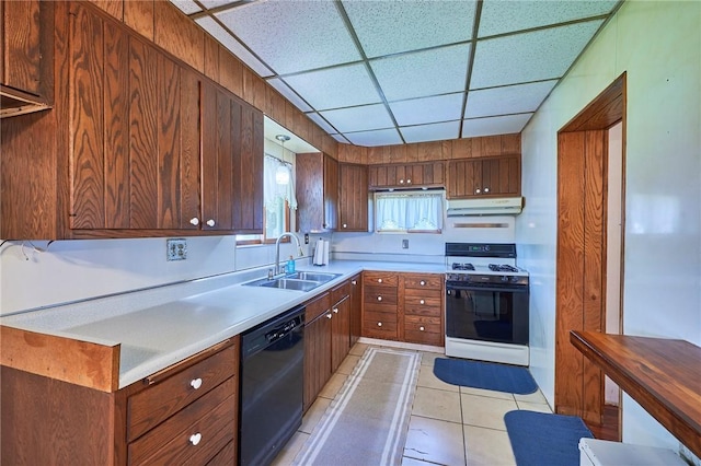 320 Garfield St, W Kittanning Boro, PA 16201 - kitchen featuring white range with gas stovetop, black dishwasher, under cabinet range hood, a sink, and light tile patterned floors