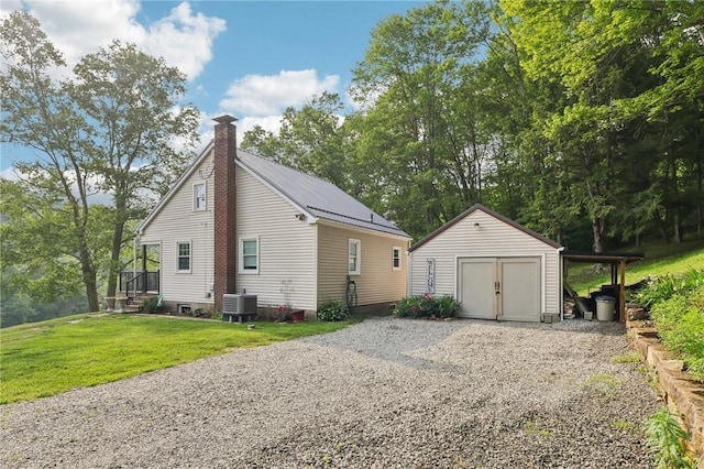 452 Clark Hollow Rd, Fairfield Twp, PA 15944 - view of property exterior with a chimney, cooling unit, and a lawn