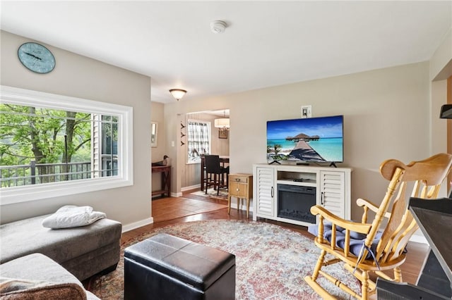452 Clark Hollow Rd, Fairfield Twp, PA 15944 - living room with baseboards, a chandelier, and tile patterned floors