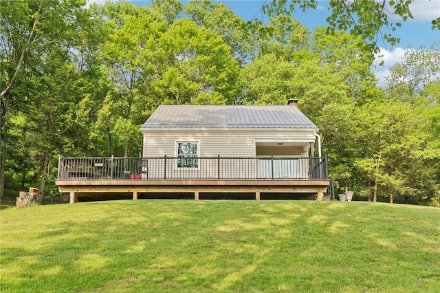 452 Clark Hollow Rd, Fairfield Twp, PA 15944 - back of property with a yard, a chimney, a deck, and metal roof