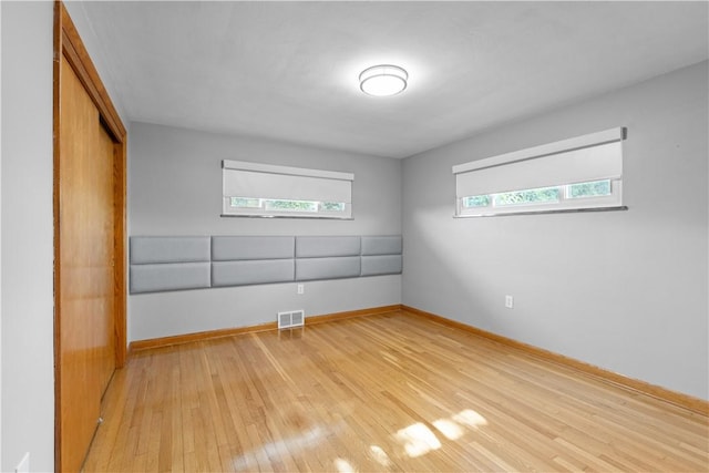 127 Craig Dr, Hempfield Twp Wml, PA 15601 - empty room featuring light wood-style floors, plenty of natural light, and baseboards