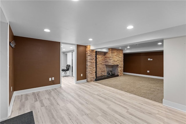 127 Craig Dr, Hempfield Twp Wml, PA 15601 - unfurnished living room with a stone fireplace, baseboards, wood finished floors, and recessed lighting