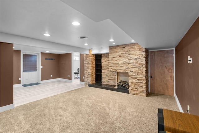 127 Craig Dr, Hempfield Twp Wml, PA 15601 - unfurnished living room with carpet flooring, baseboards, a stone fireplace, and recessed lighting