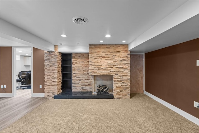127 Craig Dr, Hempfield Twp Wml, PA 15601 - unfurnished living room featuring baseboards, recessed lighting, and a stone fireplace