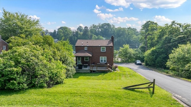 5944 Keefe St, Lincoln Place, PA 15207 - rear view of property featuring a wooden deck, a yard, and a chimney