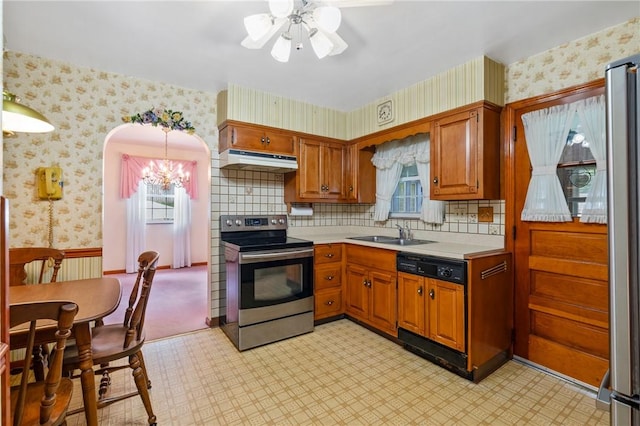 420 N St, Springdale Boro, PA 15144 - kitchen with stainless steel electric stove, under cabinet range hood, wallpapered walls, a sink, and paneled dishwasher