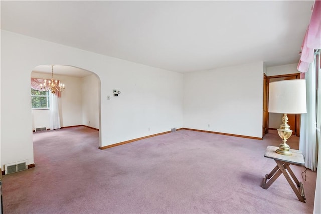 420 N St, Springdale Boro, PA 15144 - unfurnished room with arched walkways, carpet floors, a chandelier, and baseboards