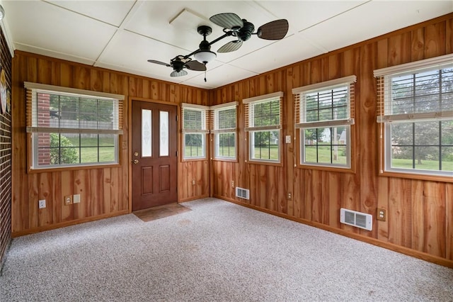 420 N St, Springdale Boro, PA 15144 - carpeted foyer entrance featuring a ceiling fan, wood walls, and baseboards