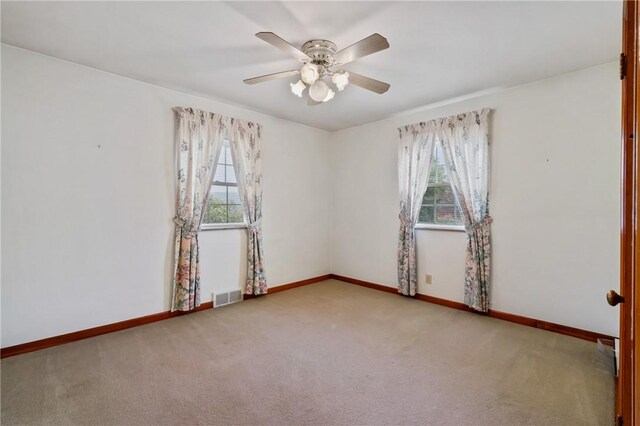 420 N St, Springdale Boro, PA 15144 - carpeted empty room with healthy amount of natural light, a ceiling fan, and baseboards