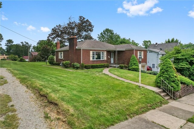 420 N St, Springdale Boro, PA 15144 - single story home with a chimney, a front yard, and brick siding