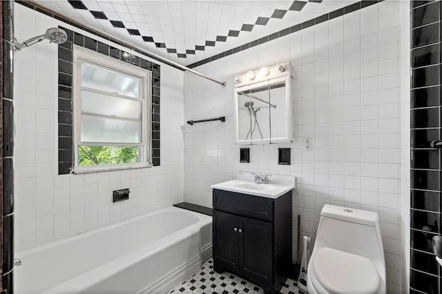 2715 Merwyn Ave, Sheraden, PA 15204 - bathroom with tile walls, vanity, toilet, shower / washtub combination, and tile patterned floors