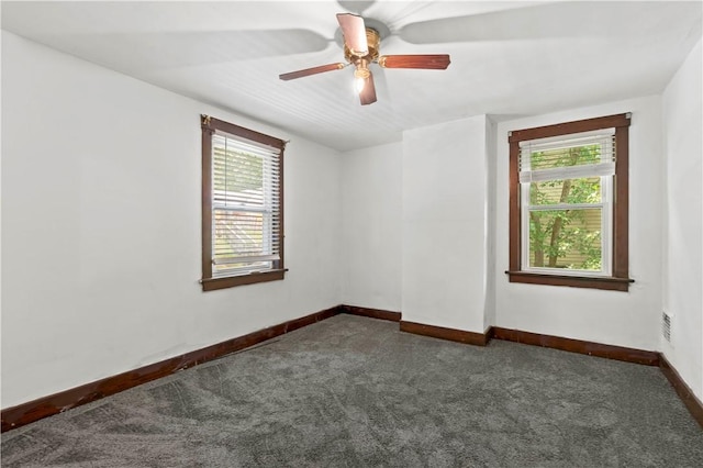 2715 Merwyn Ave, Sheraden, PA 15204 - unfurnished room featuring dark carpet, baseboards, and a ceiling fan