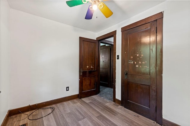 2715 Merwyn Ave, Sheraden, PA 15204 - unfurnished bedroom with baseboards, wood finished floors, and ceiling fan
