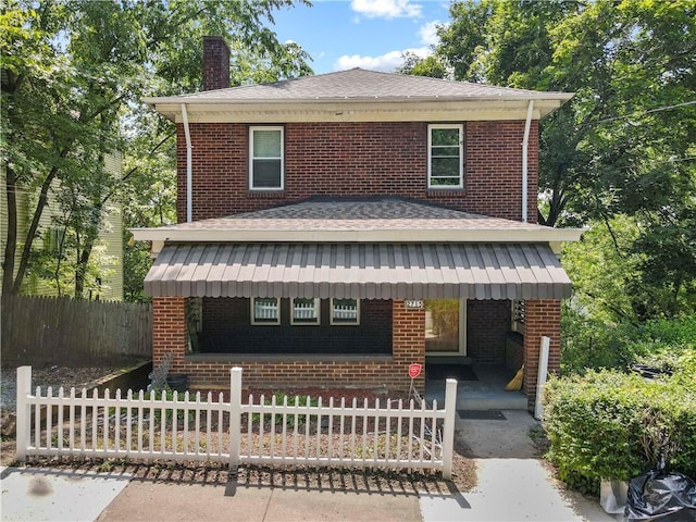 2715 Merwyn Ave, Sheraden, PA 15204 - view of front of home featuring brick siding, a fenced front yard, a shingled roof, and a chimney