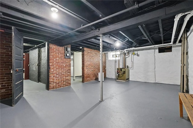 3855 Hiawatha St, Brighton Heights, PA 15212 - basement featuring brick wall and a heating unit
